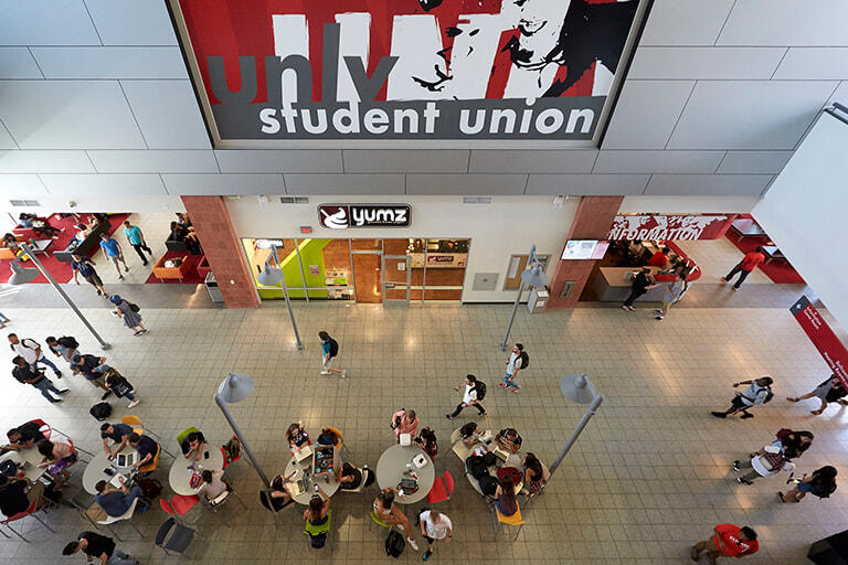 A view of inside the Student Union with students walking throughout the halls.