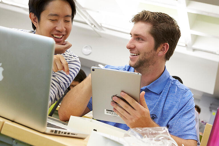 Students working together at a computer.