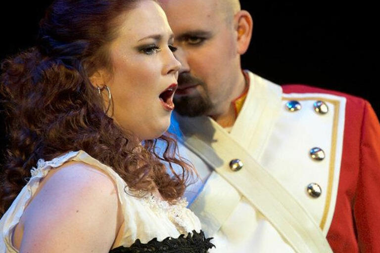 Side view of female singing