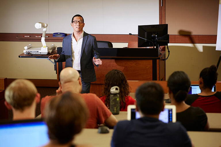A man speaking to an audience.