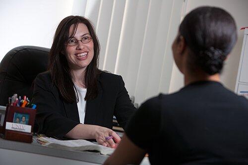 Academic advisor talks with a student.