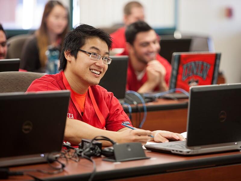 Several students seated in front of computers.