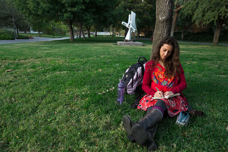 Girl Sitting Near Tree