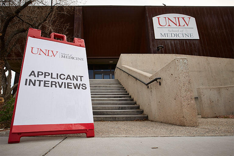 Applicant interview sign in front of the School of Medicine offices at the Shadow Lane Campus