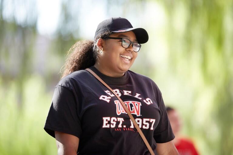 Woman with hat smiling