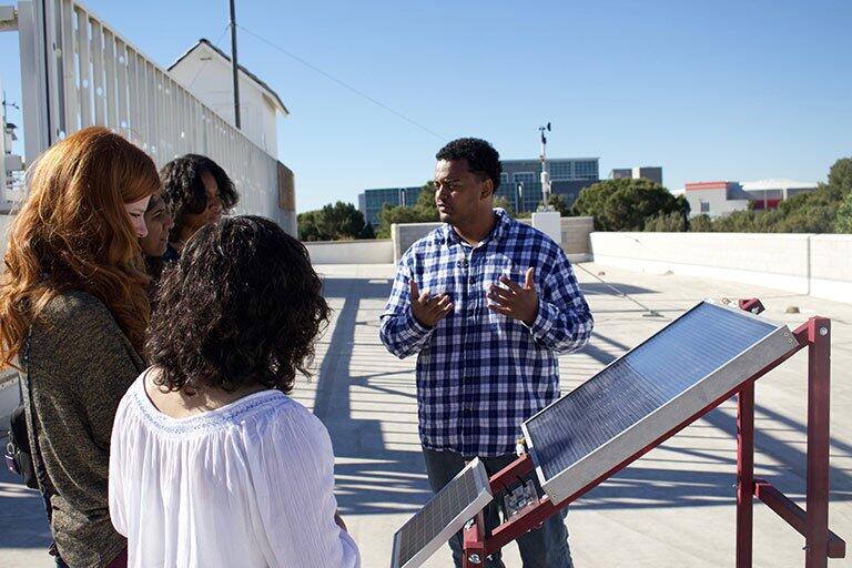A man explaining to a class.