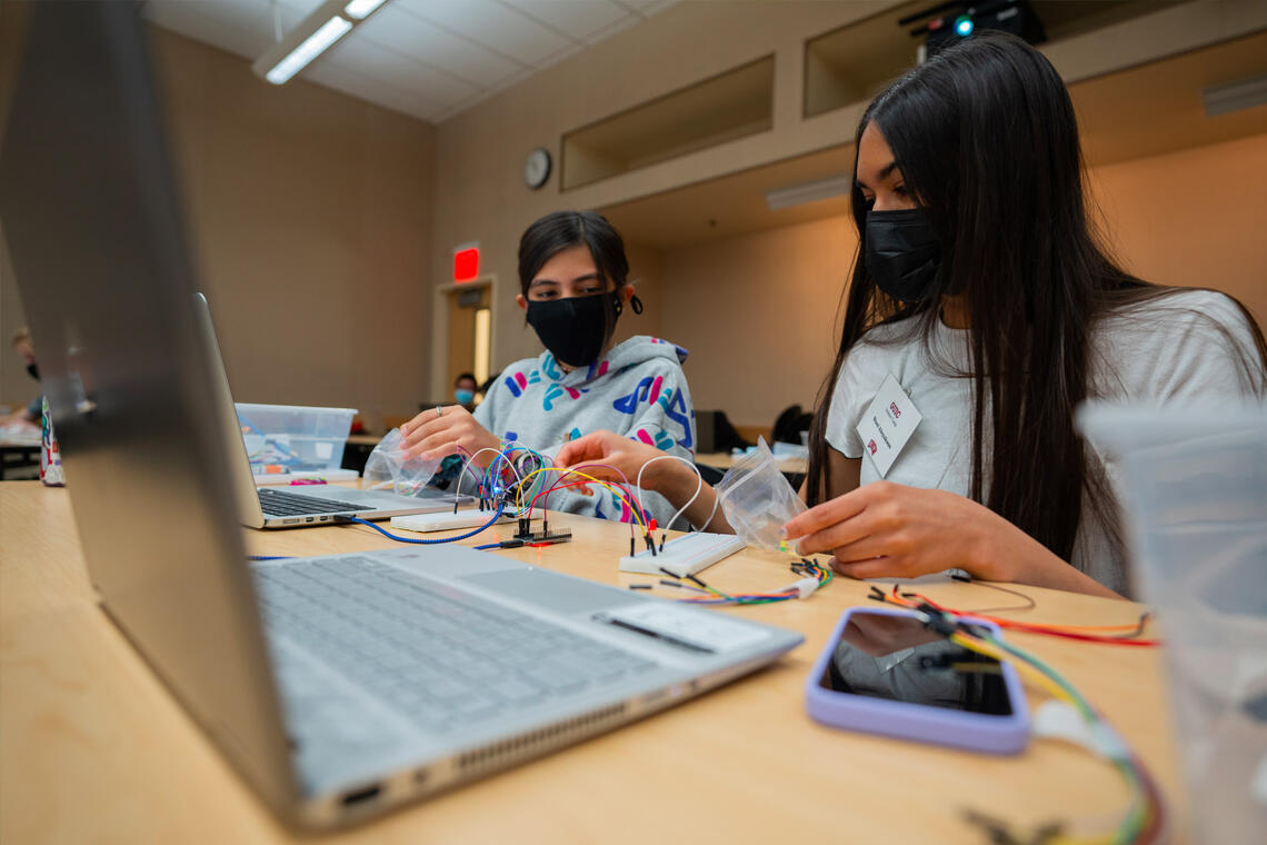 Girls working on electronics