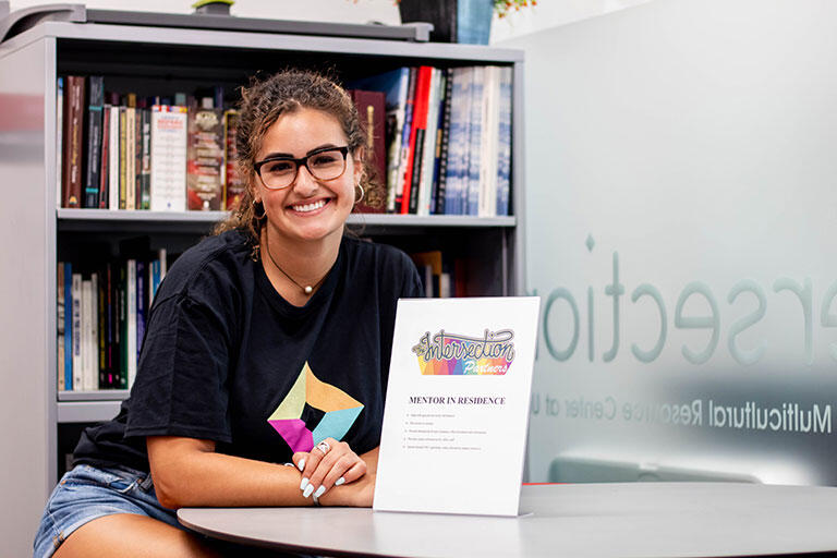 Someone sitting behind an Intersection flyer