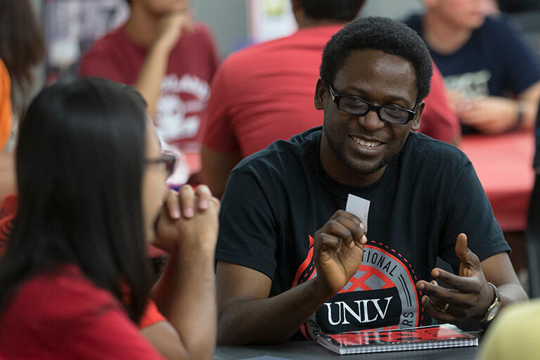 A man talking to a woman.