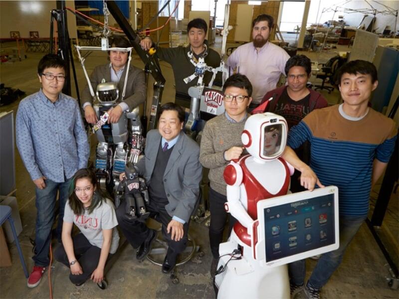 Group of students with robots