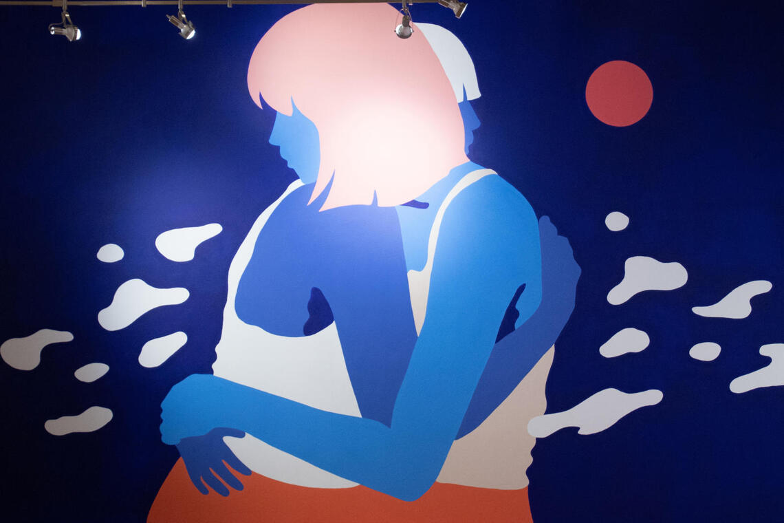 An painting of two people hugging each other