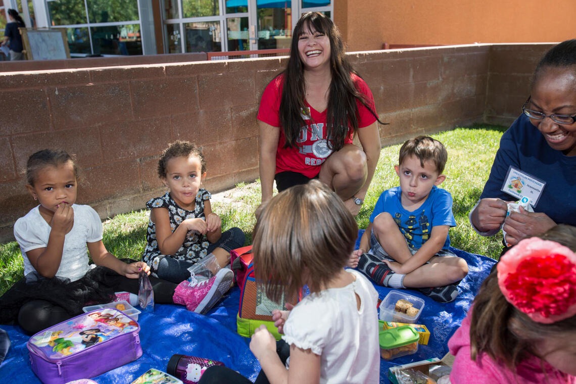 Pre-school students with their teacher.