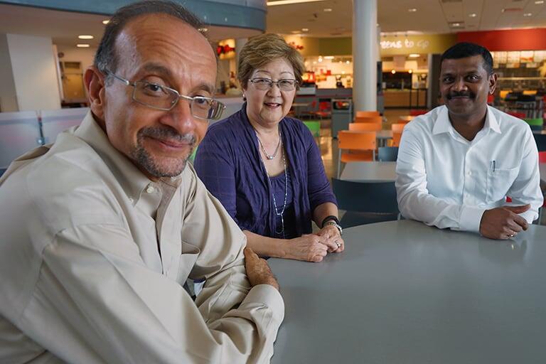 Facility sitting around a table.