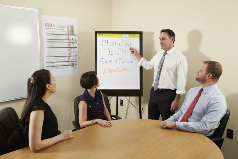 Man pointing at whiteboard