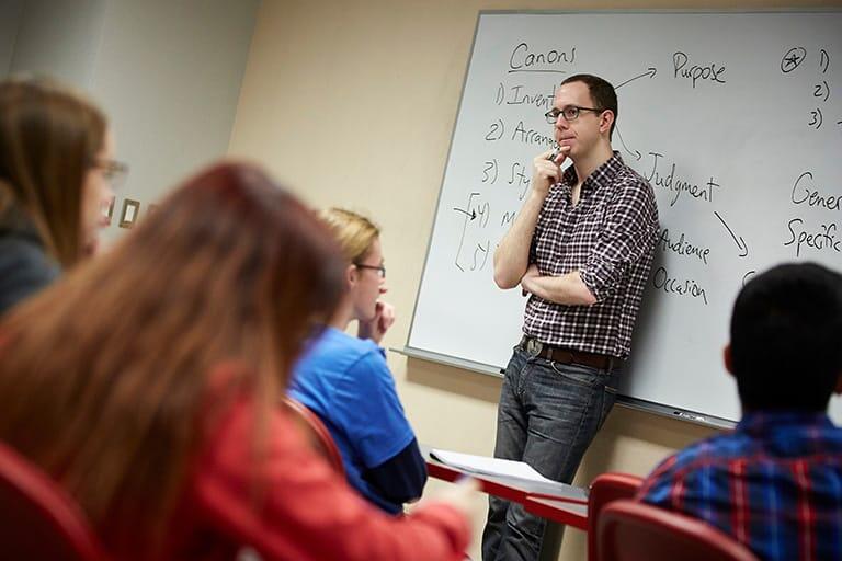 A professor teaching in a classroom