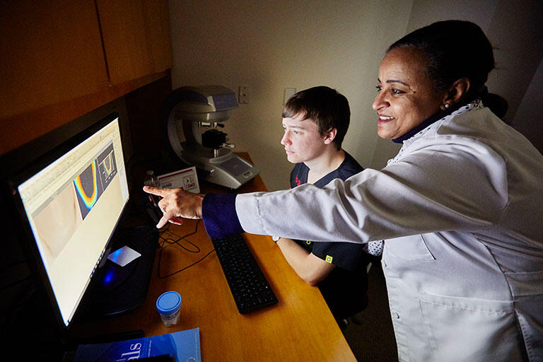 woman pointing at screen