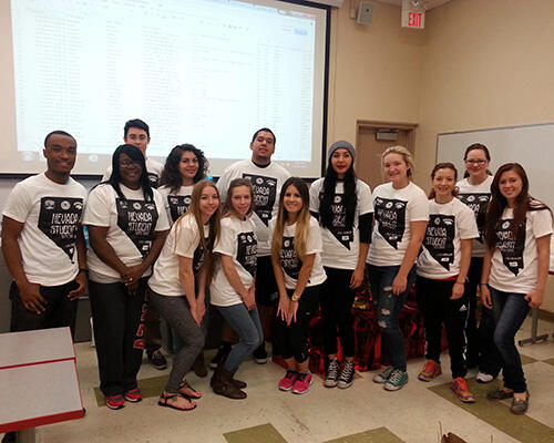 A group of people smiling