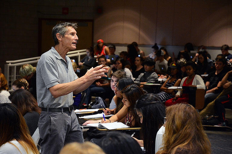 Man lectures to a classroom