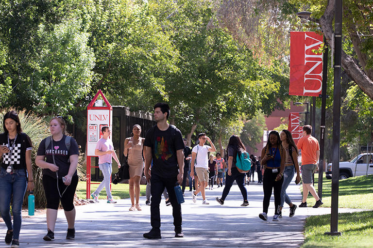 Crowd of students in academic mall.