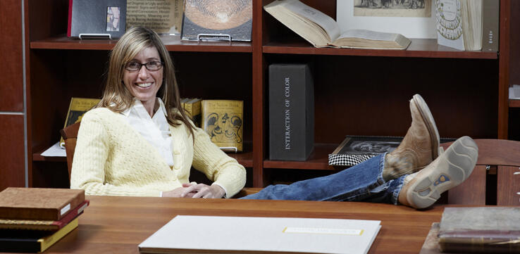 Leisl Carr Childers sits at desk