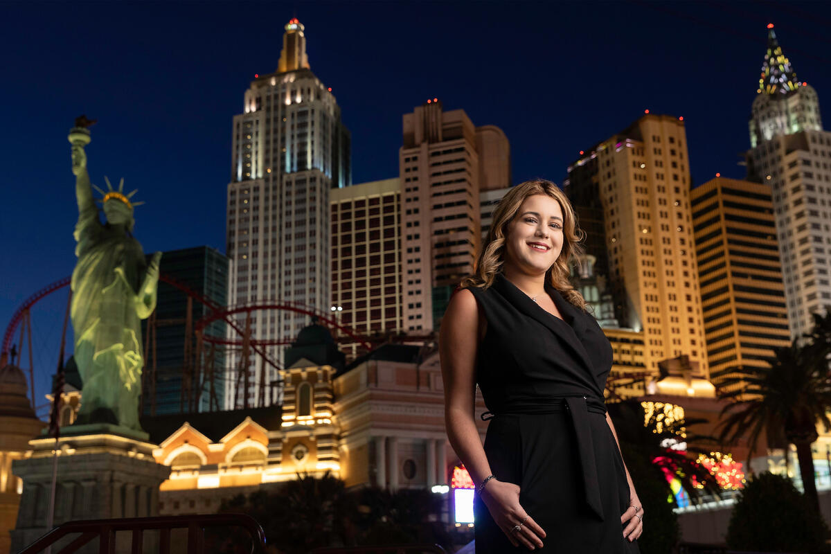 A woman poses in front of the New York-New York resort