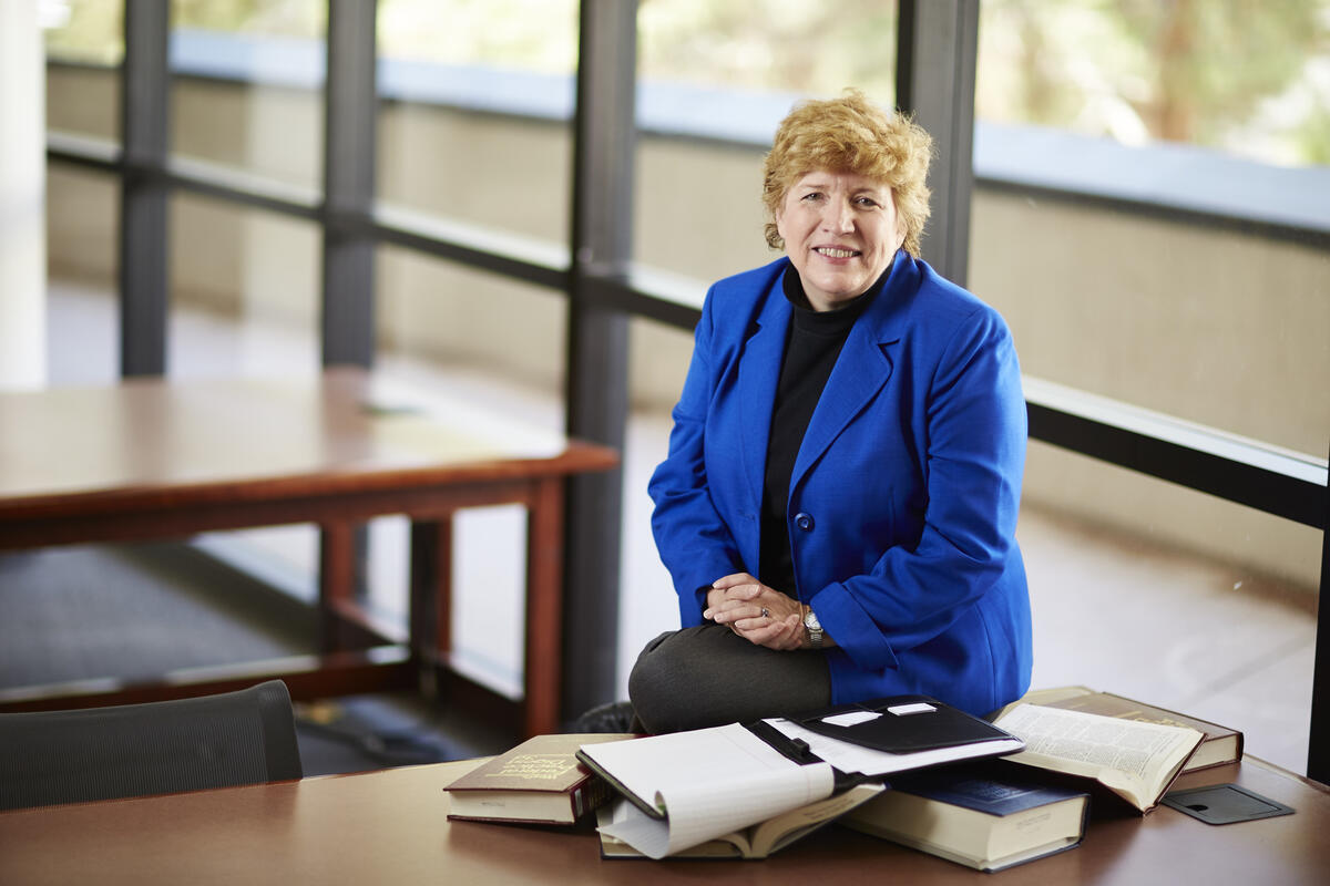 woman surrounded by books