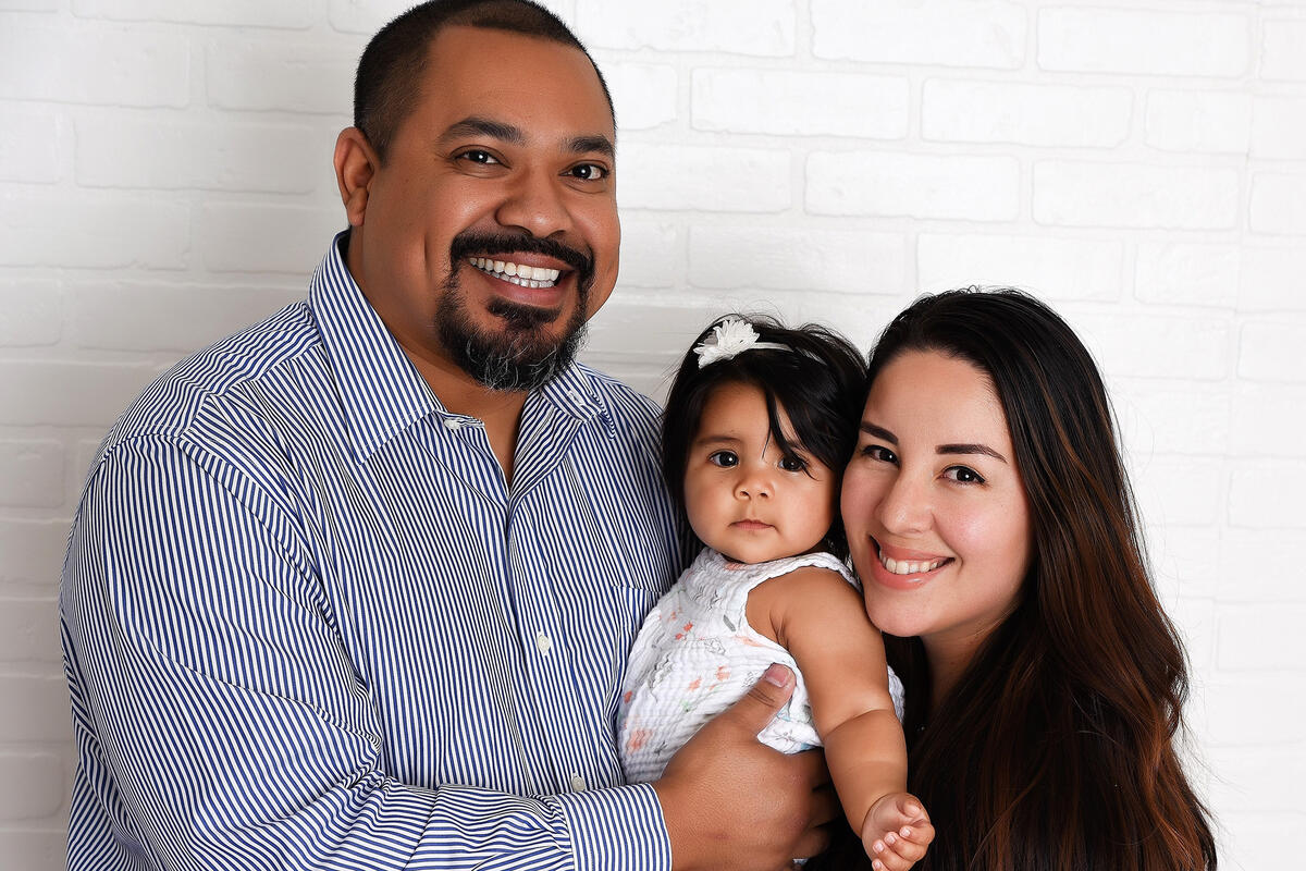 Dr. Mayra Alejandra Jones-Betancourt with her husband and daughter