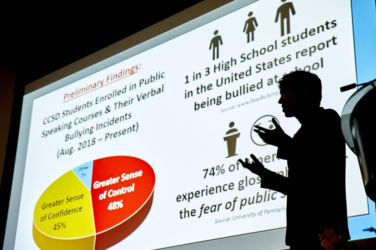 Henry Castillo presents at the Rebel Grad Slam event,