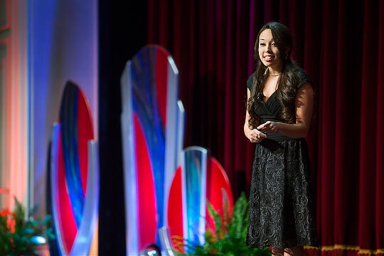 A woman in a dress on stage