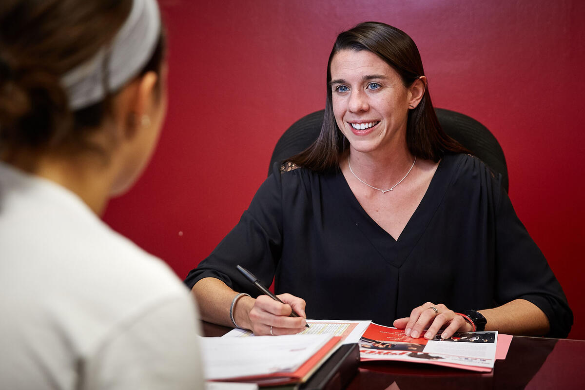 Mallory Poole talking to a student.