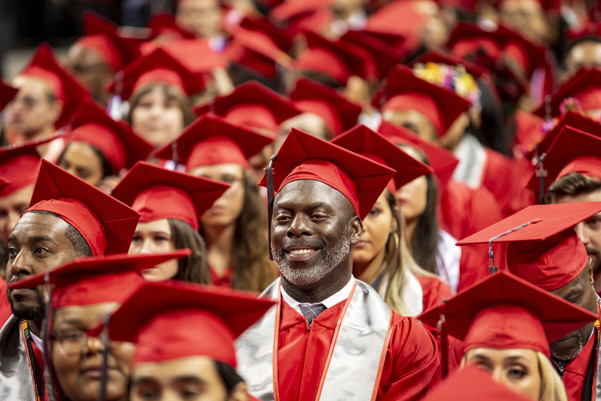 UNLV graduate in cap and gown in crowd