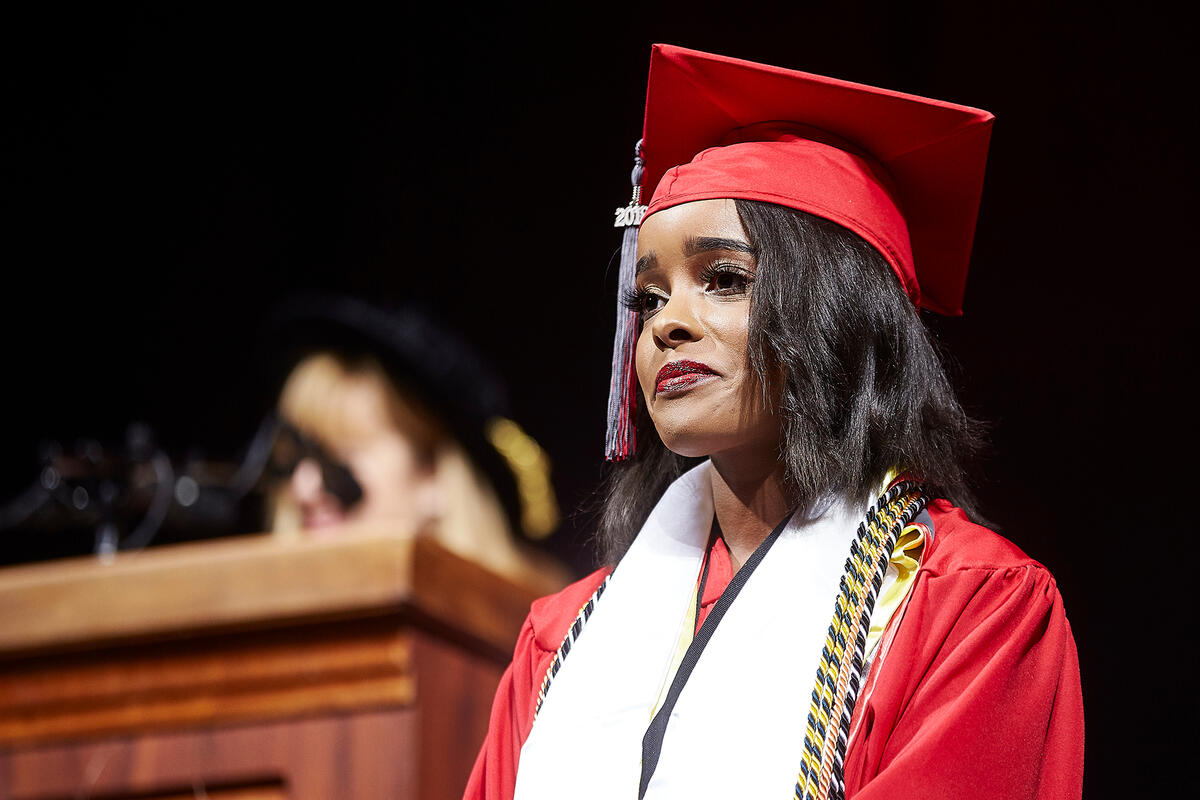 woman in commencement regalia