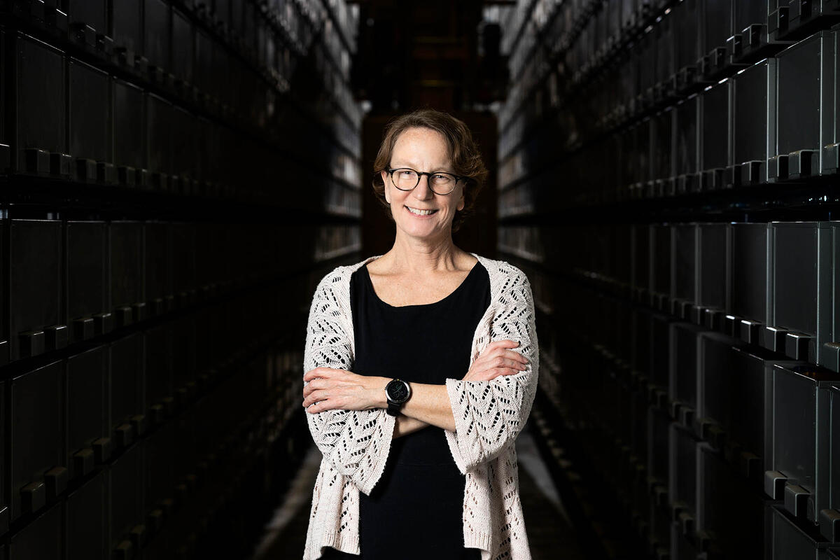 Kristen Costello poses in front the of the Lied Library Automated Storage and Retrieval System.