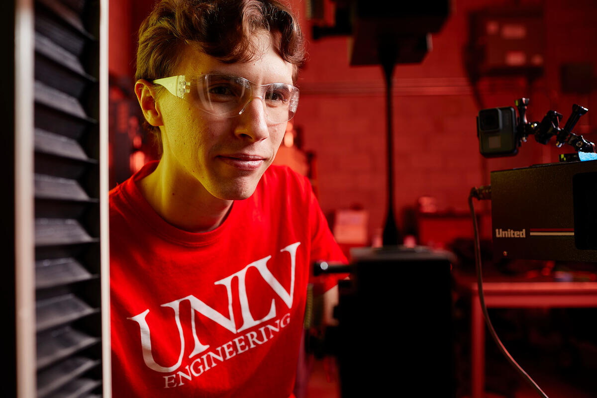 Patrick Messimertesting a the strength of a 3d printed piece of material.