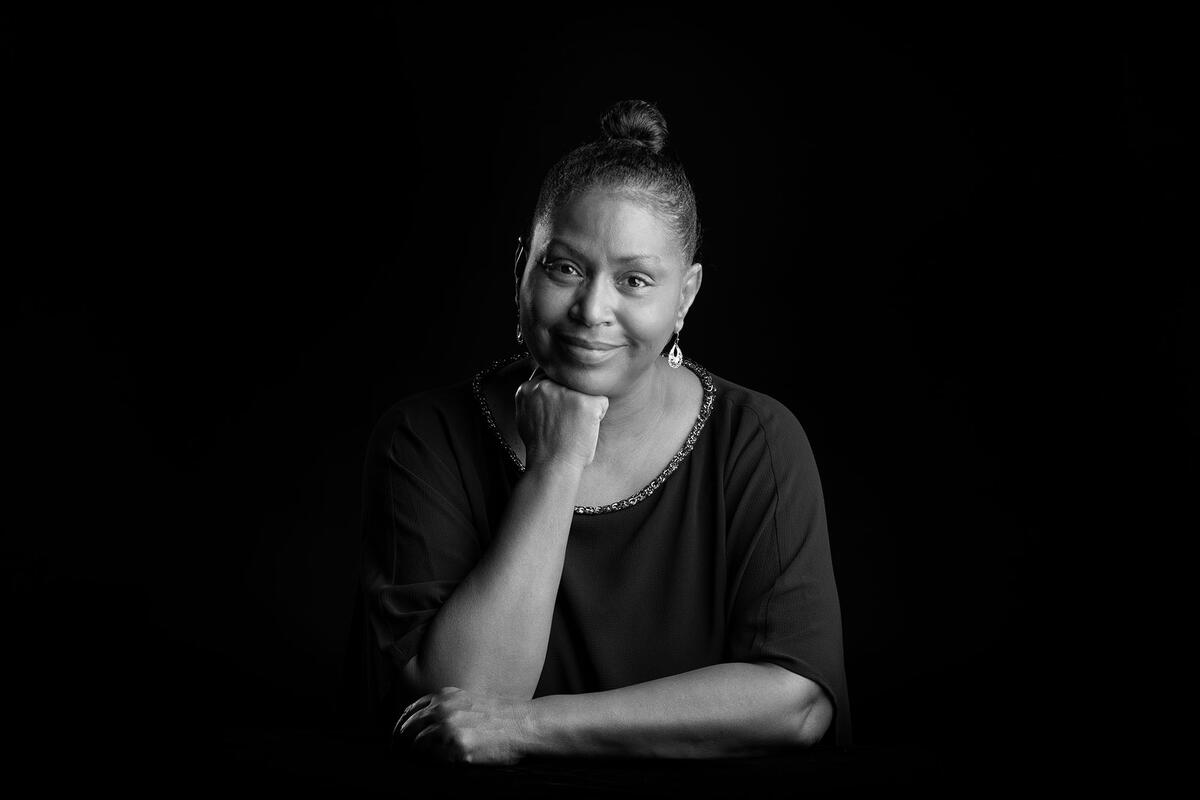 Patricia Butler with her chin resting on her hand.