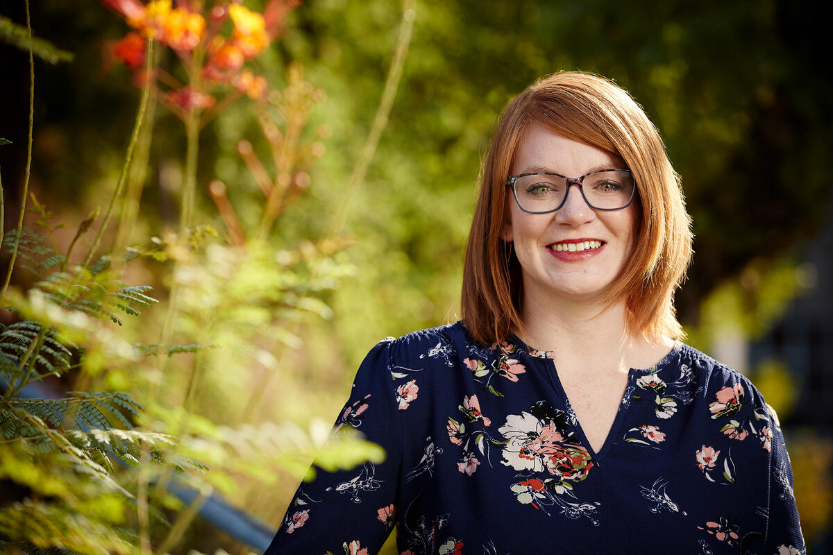 Portrait of Margaret Campe in garden.