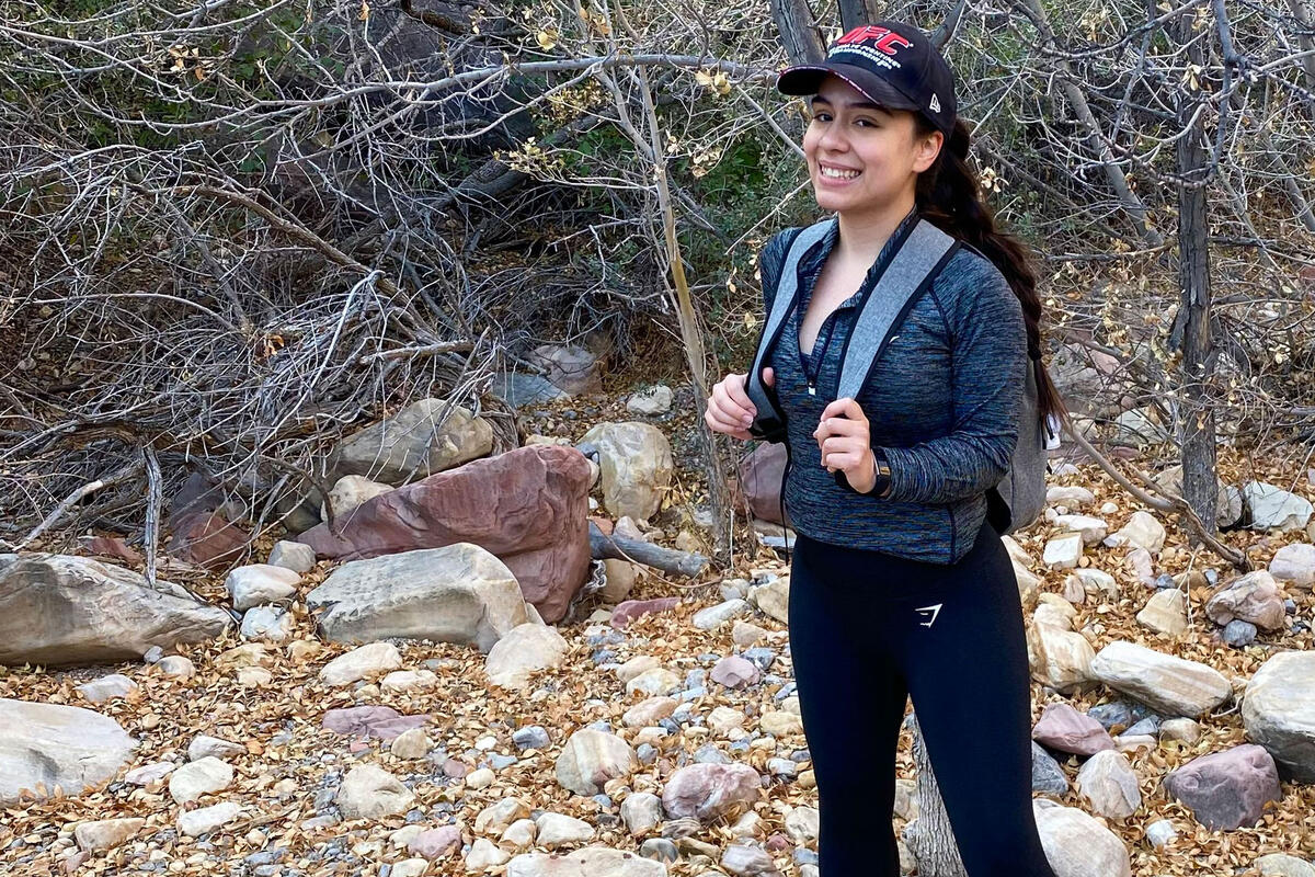 A woman stands in the forest