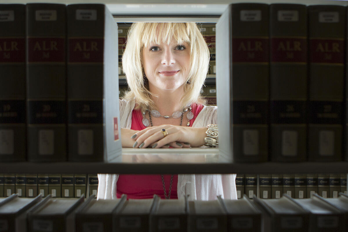 Woman framed by books