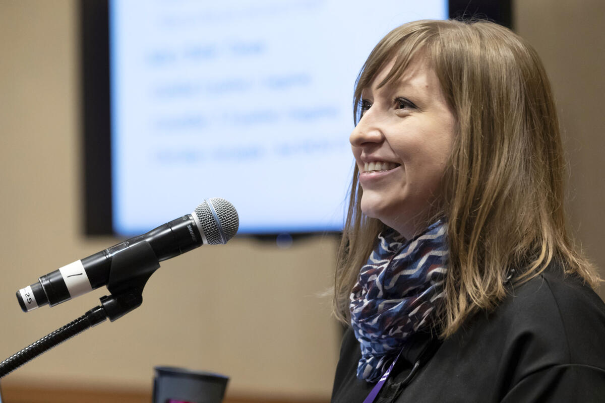 woman presenting at podium