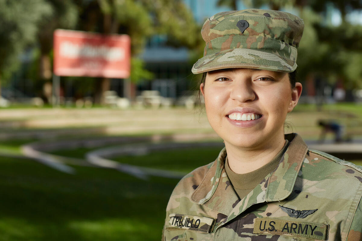 A woman in an Army uniform smiles