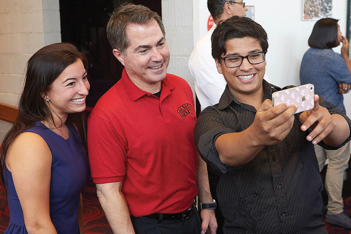 Len Jessup takes time for a selfie with this year’s student body Vice President Kanani Espinoza and President Elias Benjelloun at a May 5 event.