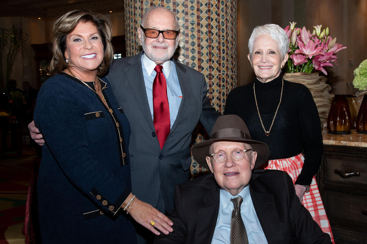 a group photo of Lexy Lionel, Samuel Lionel, Former U.S. Senator Harry Reid, and Landra Gould Reid
