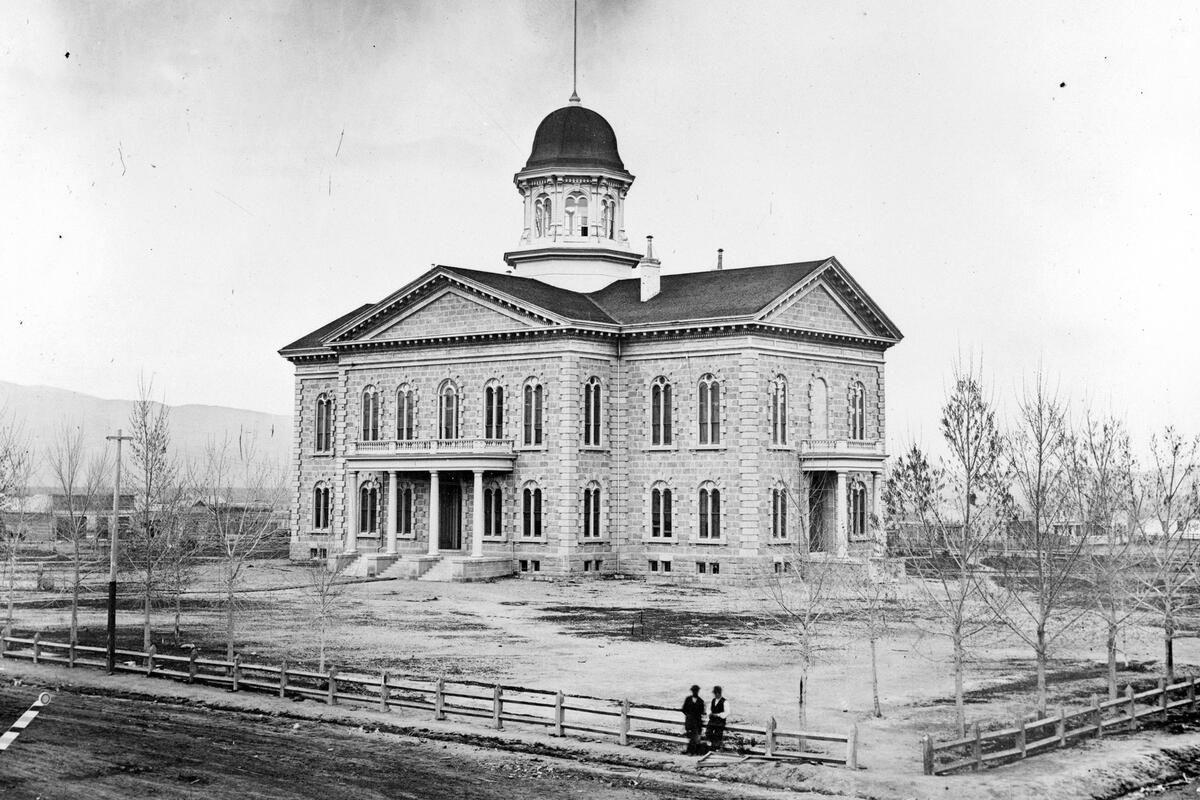 A historical photo shows the original Nevada Capitol