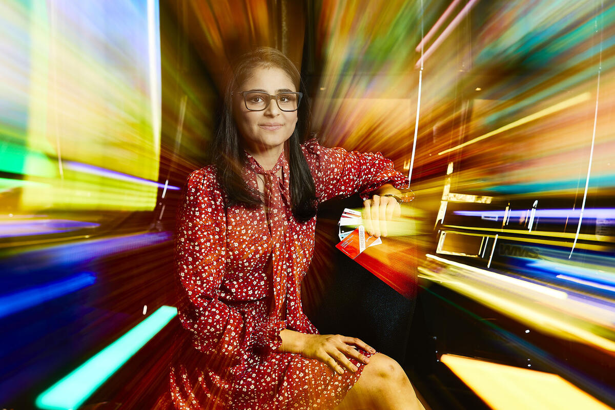 woman with motion blur of color around her