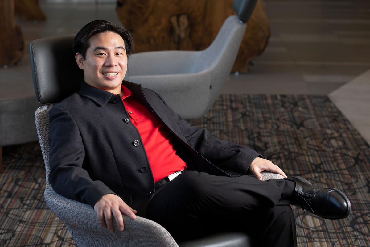 A man reclines in a chair