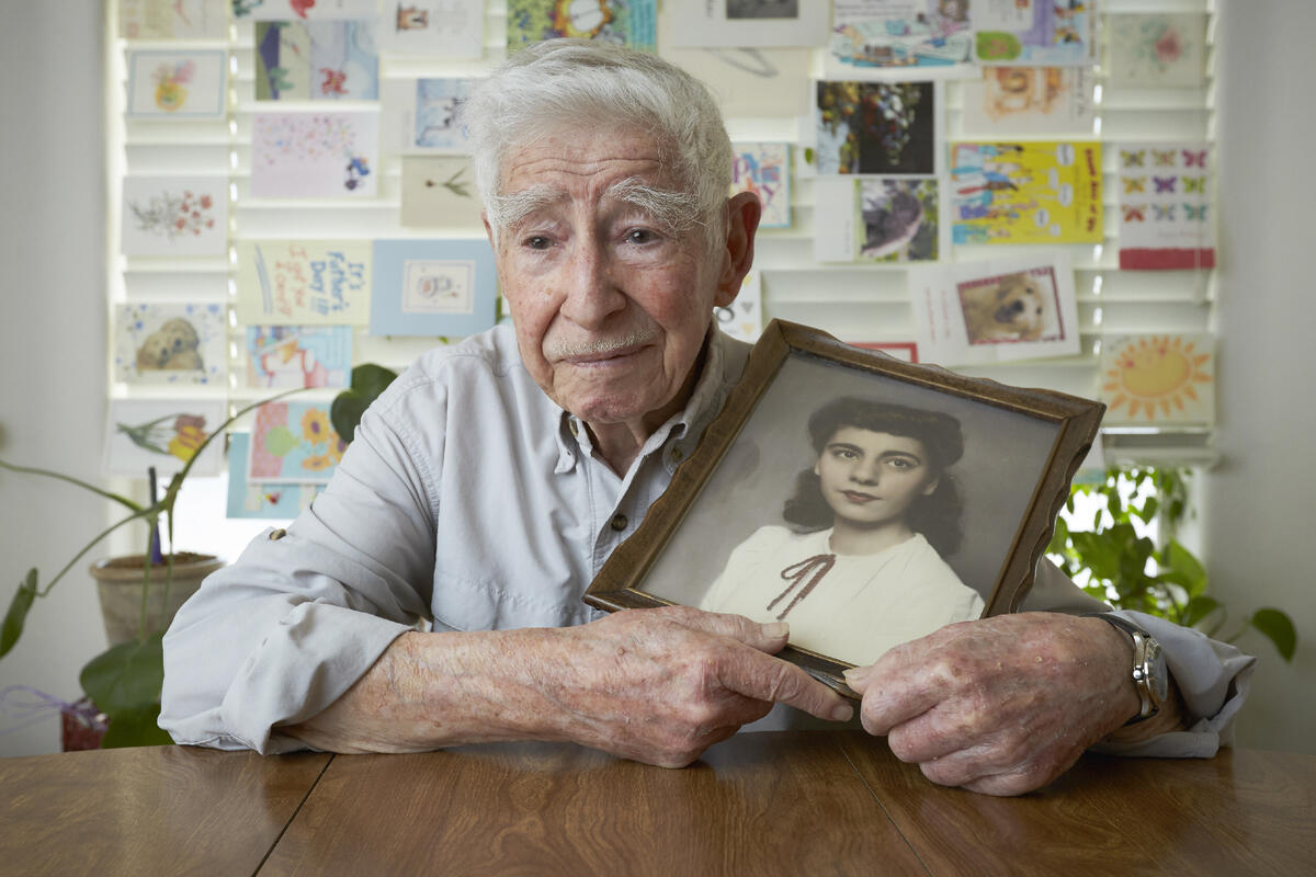 Jerome D. Countess holds a portrait of his late wife, Rachel