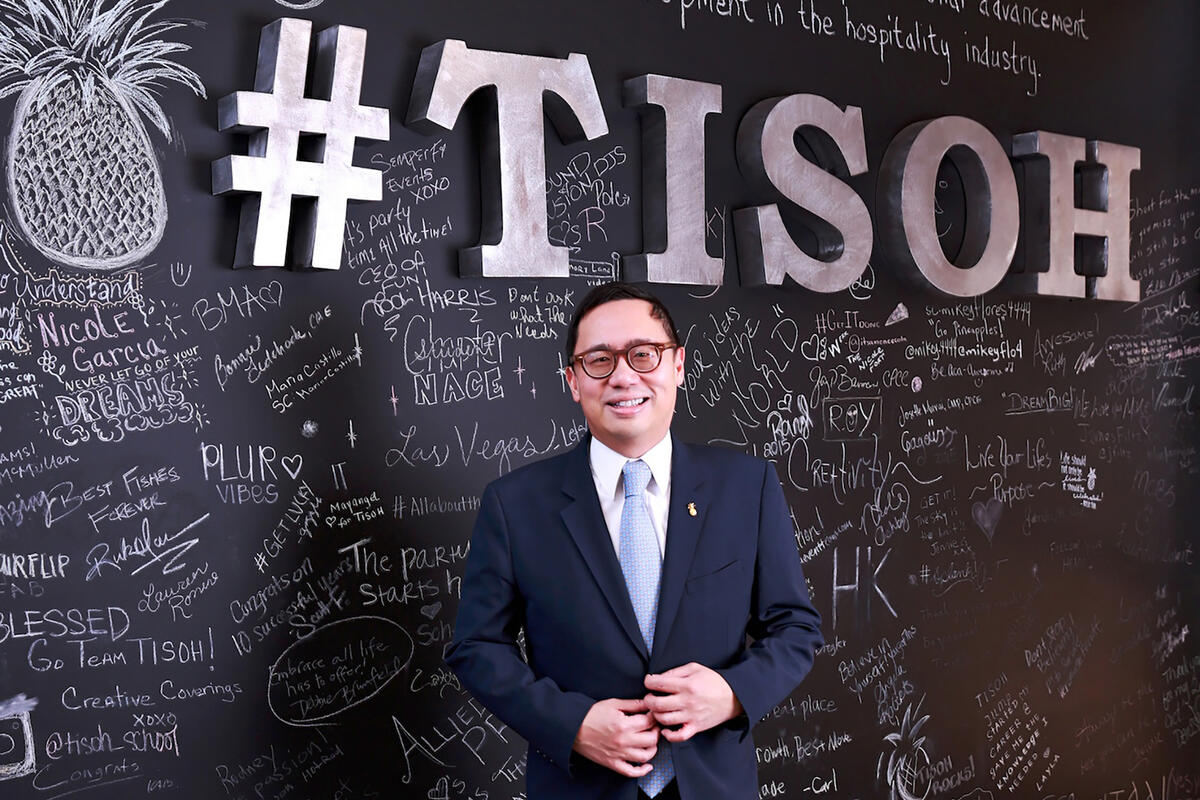 man in front of chalkboard