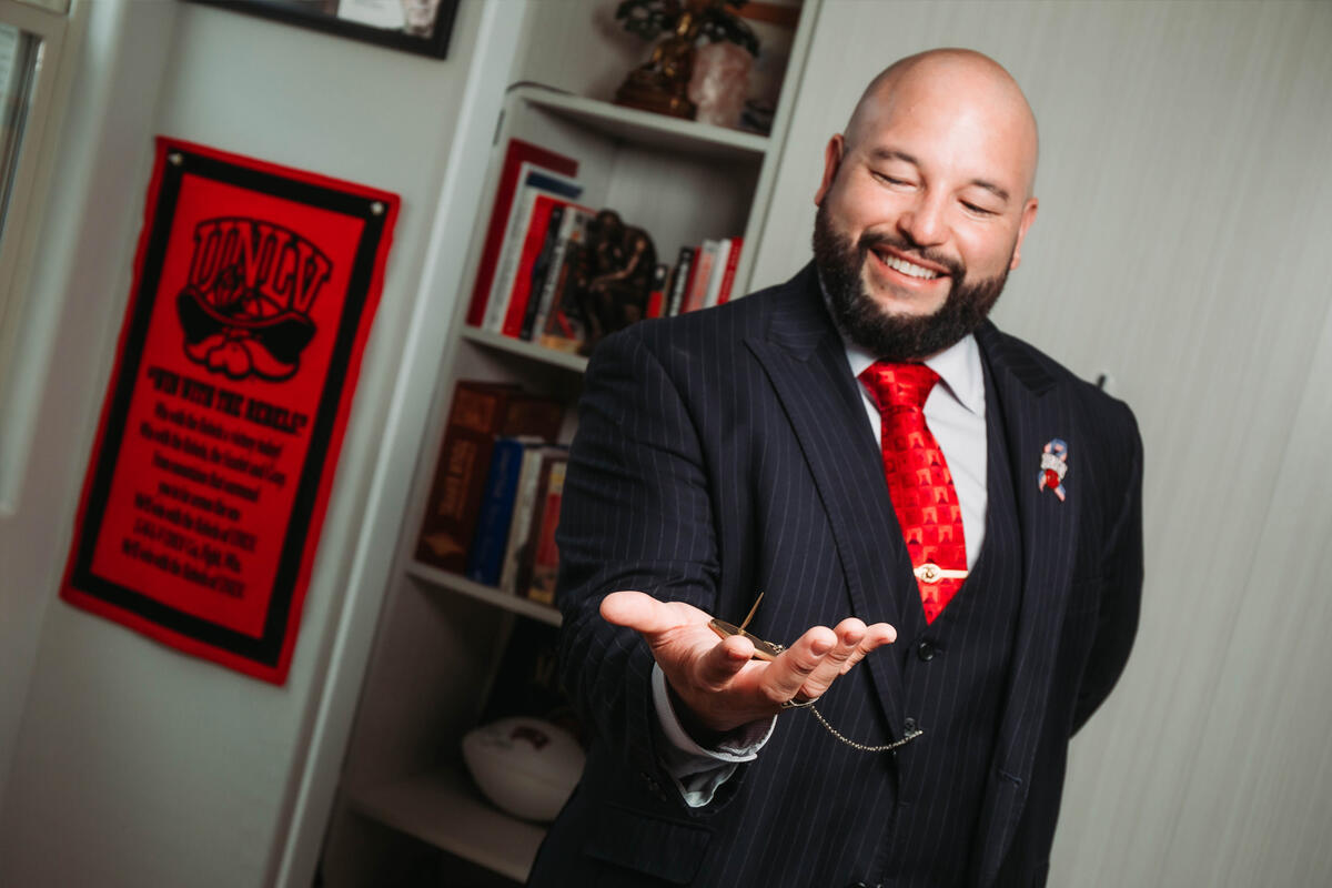 A man looks at a pocket watch