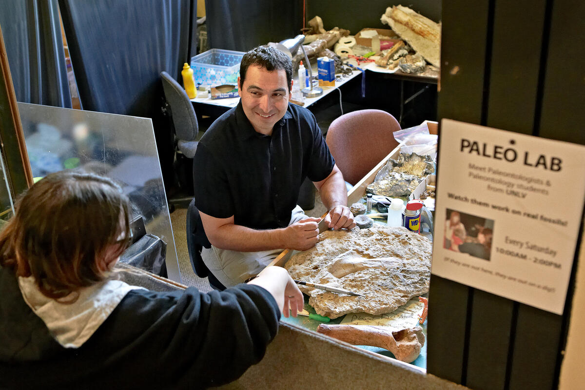 Geoscientist Josh Bonde works in the paleontology lab