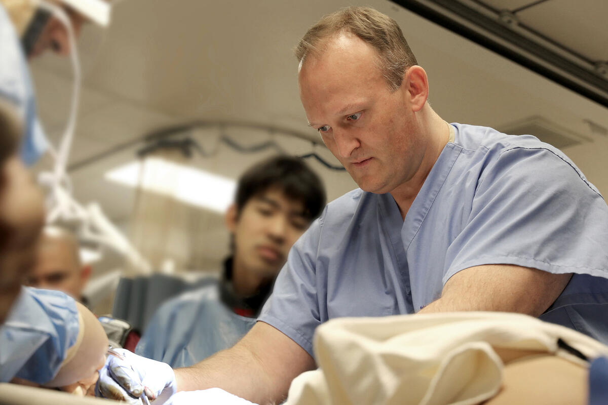 surgeon demonstrating a technique